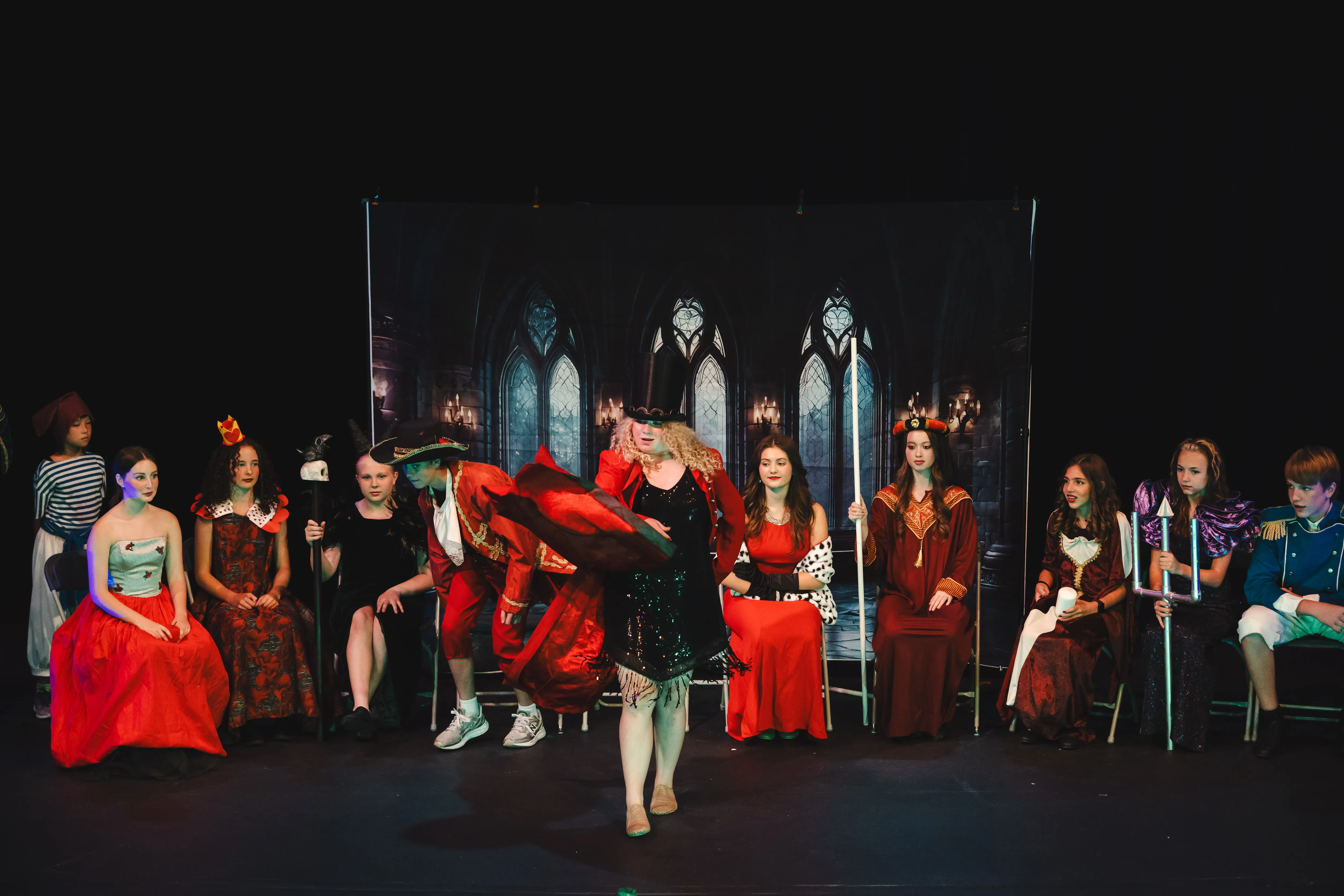 Student actors in costume on stage during Twisted Fairy Tales